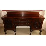 An Edwardian Chippendale style mahogany Sideboard, of inverted breakfront outline, and two centre