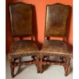 A set of 6 "Wainscot" type Chairs, each with high padded and conforming set covered in tan hide with