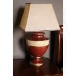 A good set of 3 vase shaped red Table Lamps, each with parchment band and square tapering shade. (3)
