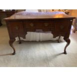 A good Queen Anne style walnut and birds eye walnut Dressing Table, 19th Century, with crossbanded