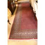 A very fine Indian Kaimuri handmade 100% woollen Carpet, with all over red ground design within a