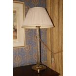 A heavy brass mounted tall Table Lamp, with spiral reeded glass stem on circular base with sprouting