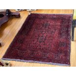 A magnificent thick pile Indian Carpet, with rows of floral medallion on a dark blue ground within a