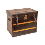 A very large leather and wooden bound Steamer Trunk, with brass studs and two leather carrying