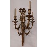 A good pair of cast brass three branch Wall Lights, each modelled as a quiver of arrows with rosette