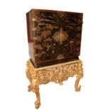 An exceptional fine 18th Century chinoiserieÿlacquered two door Cabinet on Stand, the interior