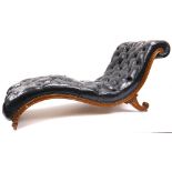 A Victorian rosewood Daybed, serpentine shaped 'S' scroll design covered in black deep button