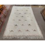 A large heavy pile Middle Eastern fawn ground woollen Carpet, with geometric design and slim border,