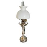 A heavy silver plated Oil Lamp, with triple knop stem, circular moulded base and cream glass