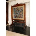 A Victorian mahogany cheval Firescreen, with tapestry panel depicting a dove above a turned