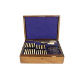 A late Victorian oak cased Canteen of plated Cutlery, by Walker & Hall, London, 12 place setting,