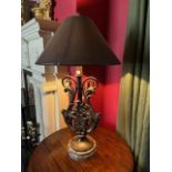 A very attractive cast metal lyre shaped Table Lamp, on a circular moulded base, with faux leather