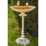 An attractive cast iron Bird Bath, with shell shaped bowl surmounted with two birds on a spiral