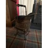 A very fine heavy 19th Century helmet shaped swing handle brass Fire Bucket, in the Egyptian Revival