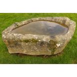 An early highly important naturally formed granite Horse Trough, with carved out centre,
