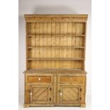 A 19th Century Irish pine Dresser, with four shelf back on a plank top base with two drawers and two