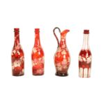 A very good late 19th Century Bohemian vine engraved ruby glass Claret Jug, 31cms (12"); together