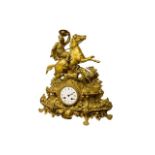 A 19th Century brass and ormolu French Mantle Clock, stamped on verso P.H. Mourey, surmounted with