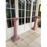 A set of 4 painted pine Torcheres, each of upward tapering fluted form with Doric capital on a