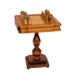 An unusual and attractive walnut Chess Table, (O.R.M.) of square serpentine form, with chess and