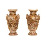 A large pair of Japanese Satsuma Vases, of baluster form each with two dragon and ring handles,