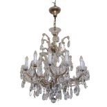 **WITHDRAWN* A Continental twelve branch Chandelier, with scrolled arms and multiple large droplets,