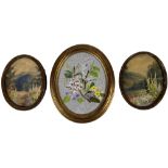 A pair of early 20th Century oval floral Needlework Pictures, with watercolour landscape background;