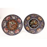 A fine pair of Japanese Meiji period bronze and cloisonné enamel Chargers, each with phoenix
