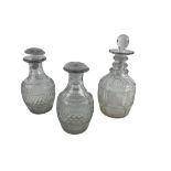 A pair of small early 19th Century Irish cutglass Carafes, each with a series of ovals above a