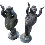 A good early pair of lead Garden Figural Ornaments, each modelled as a winged cupid holding both