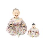 A good Chinese style porcelain Figure of a seated woman with nodding head, hands and tongue,