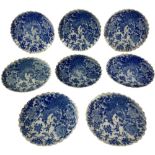 A set of 8 Japanese blue and white porcelain Plates, each with shaped edge and with peacock and
