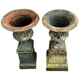 A Victorian cast iron Garden Urn, of half fluted and reeded form on upward tapering square plinth,