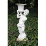 A pair of large cast iron Urns, with cherubs holding reeded vases, on circular plinth base, each