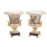 A colourful pair of Serves style campana shaped porcelain Urns, each decorated with birds and