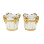 A good attractive pair of Limoges white and parcel gilt Ice Buckets, each of barrel form and with