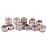 A collection of 11 silver Napkin Rings, various shapes and dates, 240 grams. (11)