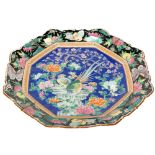 A large octagonal Famille Noir Chinese Platter, profusely decorated with flowers, birds, butterflies