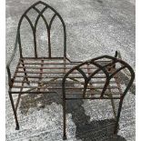 A very rare Gothic Revival wrought iron Lovers Garden Seat, with arched open work back and slatted
