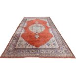 A very large burgundy ground Oriental wool Carpet, with large centre fawn floral medallion with