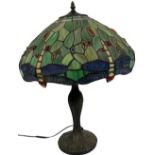 A "Tiffany" style stained glass shade Table Lamp, with dragonfly design, on moulded metal base. (1)