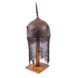 A fine Persian Helmet (Kulah Khud), 19th Century with spike finial on dome head chased with deer