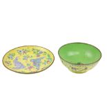 A good yellow and green ground Chinese enamel Bowl, decorated with flowers and trophies, 20cms (