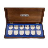 A cased set of silver plated Royal Coat of Arms, borne by the various Kings, each with shield