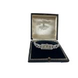 An attractive Art Deco 'Cartier' style Ladies platinum and diamond Wrist Watch, approx. 24.5g (