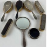 Four silver backed Brushes, and a silver backed Hand Mirror; together with two silver mounted and