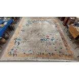 A superb large wool Carpet, the beige ground with all over floral and leaf sprays inside a