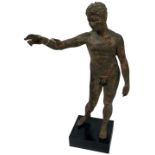 A heavy bronze Figure, of a nude male with right hand pointing forward on rectangular black base,