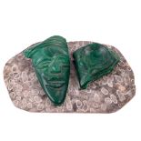 A good African carved malachite Mask, 14cms (5 1/2"), together with another piece of carved