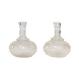 A pair of late 19th Century cutglass Water Carafes, 17cms (6 1/2") a circular cutglass Jar and